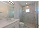 Elegant bathroom features a glass-enclosed shower, sleek fixtures, and a spacious vanity at 17110 Verona Pl, Bradenton, FL 34202