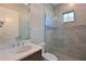Modern bathroom with glass shower and stylish tile, with sleek fixtures and a well-lit mirror at 17110 Verona Pl, Bradenton, FL 34202