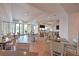 Bright dining room with bar, tables, chairs and outdoor views at 17110 Verona Pl, Bradenton, FL 34202