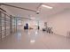 Spacious garage with epoxy floors, high ceilings, and ample storage space at 17110 Verona Pl, Bradenton, FL 34202