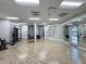Spacious gym with modern equipment, mirrors, and bright lighting at 17110 Verona Pl, Bradenton, FL 34202