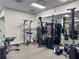 Well-equipped gym featuring modern exercise machines, weights, and mirrors for a complete workout at 17110 Verona Pl, Bradenton, FL 34202