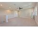 Spacious loft area with natural light, neutral paint, and modern ceiling fan at 17110 Verona Pl, Bradenton, FL 34202