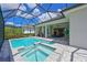 Backyard featuring pool with an attached spa, pool deck, covered lanai, and outdoor kitchen at 17110 Verona Pl, Bradenton, FL 34202