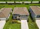 Real estate featuring a landscaped yard with healthy green grass at 17209 Barnwood Pl, Bradenton, FL 34211