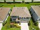 Aerial view of a well-maintained home featuring a landscaped yard and a neutral color palette at 17209 Barnwood Pl, Bradenton, FL 34211