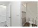 Bathroom includes a shower and toilet with gray and white finishes at 17209 Barnwood Pl, Bradenton, FL 34211