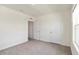 Bedroom with plush carpeting, fresh paint, and a large window allowing natural light at 17209 Barnwood Pl, Bradenton, FL 34211