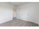 Bedroom features plush gray carpeting, white walls and trim, and a door to the walk-in closet at 17209 Barnwood Pl, Bradenton, FL 34211