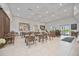 Spacious cafe with tables, chairs, and community information in a bright and airy setting at 17209 Barnwood Pl, Bradenton, FL 34211