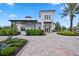 Inviting clubhouse exterior featuring a covered patio and a well-manicured landscape design at 17209 Barnwood Pl, Bradenton, FL 34211