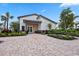 Community clubhouse featuring a welcoming entrance, manicured landscaping, and ample seating at 17209 Barnwood Pl, Bradenton, FL 34211