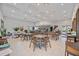 Open-concept dining area with neutral decor offers ample seating at 17209 Barnwood Pl, Bradenton, FL 34211