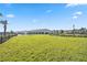 Expansive dog park featuring lush green grass and secure fencing at 17209 Barnwood Pl, Bradenton, FL 34211