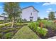 Modern two-story building featuring attractive landscaping and welcoming entrance at 17209 Barnwood Pl, Bradenton, FL 34211