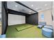 Golf simulator with seating area for leisure at 17209 Barnwood Pl, Bradenton, FL 34211