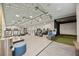 Fitness center equipped with treadmills, elliptical machines, and a golf simulator at 17209 Barnwood Pl, Bradenton, FL 34211