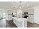 Modern kitchen with stainless steel appliances, grey cabinets, stylish island, and pendant lighting at 17209 Barnwood Pl, Bradenton, FL 34211