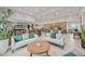 Relaxing lounge area with comfortable seating, modern decor, and a coffee bar in a bright, open space at 17209 Barnwood Pl, Bradenton, FL 34211