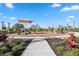 Colorful community playground with modern equipment and ample space for children at 17209 Barnwood Pl, Bradenton, FL 34211