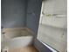 Bathroom featuring a garden tub and window at 17215 Berwin Ave, Port Charlotte, FL 33948