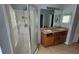 Bathroom with a glass shower, vanity, and dual sinks at 17215 Berwin Ave, Port Charlotte, FL 33948