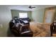 Room featuring lots of seating, a ceiling fan, and a view of the outdoors at 17215 Berwin Ave, Port Charlotte, FL 33948