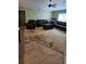 Large living room area with ceiling fan and light at 17215 Berwin Ave, Port Charlotte, FL 33948