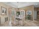 Formal dining room with decorative chandelier, large windows, and elegant furnishings at 2016 White Feather Ln, Nokomis, FL 34275