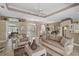 Inviting living room boasts tile flooring, comfortable seating, and a bright, open layout at 2016 White Feather Ln, Nokomis, FL 34275