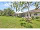 Expansive backyard featuring well-maintained lawn and screened patios, offering a serene outdoor living space at 2025 Lynx Run, North Port, FL 34288