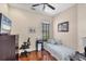 Bright bedroom with wood floors, daybed and desk setup for work or study at 2025 Lynx Run, North Port, FL 34288
