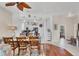 Dining area with wood table and chairs, with an open view of the kitchen at 2025 Lynx Run, North Port, FL 34288