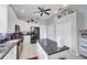 Modern kitchen with white cabinetry, black appliances, and center island at 2025 Lynx Run, North Port, FL 34288