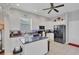Kitchen featuring white cabinets, a central island, and black appliances at 2025 Lynx Run, North Port, FL 34288
