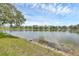 Beautiful lake view showcasing tranquil water and lush vegetation, creating a serene natural backdrop at 2025 Lynx Run, North Port, FL 34288