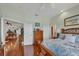 Hardwood floors in this main bedroom connect to other parts of the home at 2025 Lynx Run, North Port, FL 34288