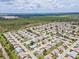 Sprawling aerial perspective of a well-planned neighborhood surrounded by lush greenery at 204 Aspen St, Englewood, FL 34223