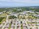 Expansive aerial view of a residential community near the water, offering a serene coastal lifestyle at 204 Aspen St, Englewood, FL 34223