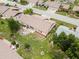 Drone shot highlighting the well-maintained backyard, patio area, and nearby residential streets at 204 Aspen St, Englewood, FL 34223