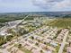 Wide aerial shot of a peaceful community with tidy homes, mature trees, and accessible roadways at 204 Aspen St, Englewood, FL 34223