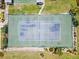 Overhead view of tennis courts and landscaping with vibrant surroundings, perfect for recreation at 204 Aspen St, Englewood, FL 34223