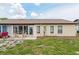 Cozy backyard patio is ideal for relaxation and outdoor living at 204 Aspen St, Englewood, FL 34223