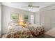 Bedroom featuring two twin beds, soft carpet, and light-filled view at 204 Aspen St, Englewood, FL 34223