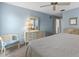 Bedroom featuring a king bed, soft carpet, and light-filled view at 204 Aspen St, Englewood, FL 34223