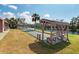 Bocce ball court with covered bench and scenic water views, perfect for outdoor recreation at 204 Aspen St, Englewood, FL 34223
