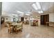 Expansive common area featuring various seating arrangements and billiards tables for recreation at 204 Aspen St, Englewood, FL 34223