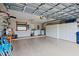Spacious garage featuring ample storage cabinets and a laundry area at 204 Aspen St, Englewood, FL 34223