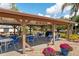 Outdoor grilling area with seating and covered picnic area, perfect for enjoying a meal at 204 Aspen St, Englewood, FL 34223