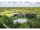 Lush grounds with equestrian facilities, a large house with a pool, plus mature trees create a private retreat at 21210 77Th E Ave, Bradenton, FL 34202